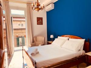 A bed or beds in a room at Aqua Claudia and Anio Novus Apartments