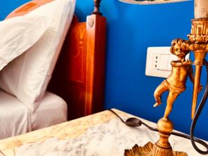 A bed or beds in a room at Aqua Claudia and Anio Novus Apartments