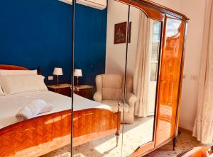 A bed or beds in a room at Aqua Claudia and Anio Novus Apartments