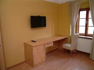 Televízia a/alebo spoločenská miestnosť v ubytovaní Apartments and Suites Kremnica