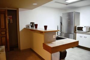 Kuchyň nebo kuchyňský kout v ubytování Superbe Appartement PMR avec parking Gratuit