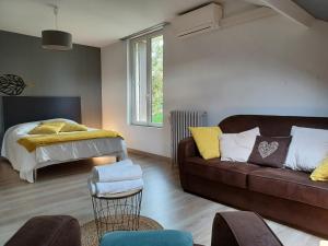 Posteľ alebo postele v izbe v ubytovaní La maison d'adèle