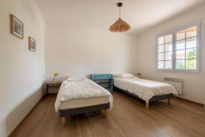 Posteľ alebo postele v izbe v ubytovaní Belle maison proche de la mer pour 6 personnes