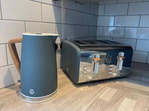 a toaster oven sitting on top of a counter at The Mancunian @ The Gathering - Sleeps Up To 6 in Sale