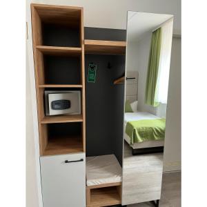 Postel nebo postele na pokoji v ubytování Hotel und Restaurant Kranichsberg