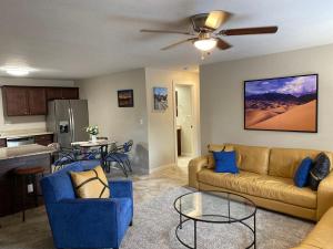 a living room with a couch and a table at Bell & Main Alamosa Studio Suite-Walking distance to downtown in Alamosa