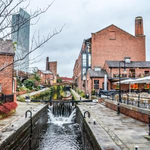 a canal in the middle of a city with buildings at The Castlefield @ The Gathering - Sleeps Up To 5 in Sale