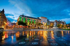 a city street at night with buildings and lights at The Bridgewater Studio @ The Gathering - Sleeps Up To 4 in Sale