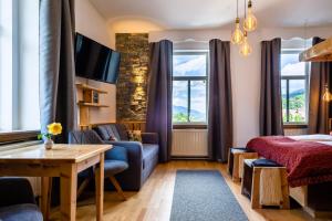 a hotel room with a bed and a table at Kaiserhof in Reichenau