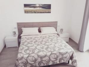 Postel nebo postele na pokoji v ubytování un passo dal mare