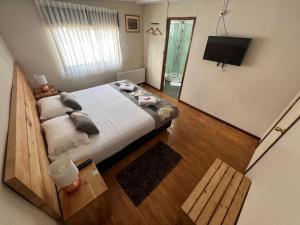 Postel nebo postele na pokoji v ubytování Hostal Reymer Patagonia