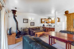 a living room with a couch and a table at Sierra Del Sol 5 in Taos Ski Valley