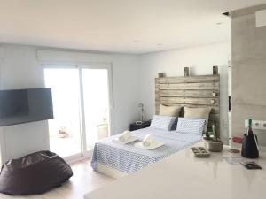 Televisyen dan/atau pusat hiburan di MI BARCO - LOFT frente al mar