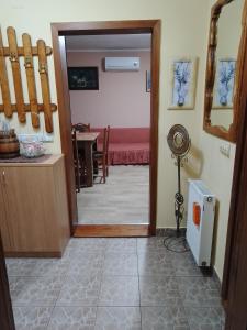 a room with a door and a room with a table at Jovanovic in Topola