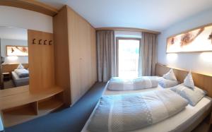 Postel nebo postele na pokoji v ubytování Residence Haus Peder