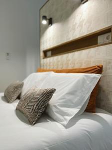 Uma cama ou camas num quarto em Alto do Ferrum - Boutique Villa