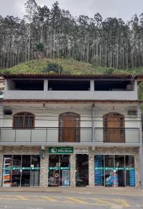 a building with a grass hill on top of it at Spazio Martinelli in Santa Teresa