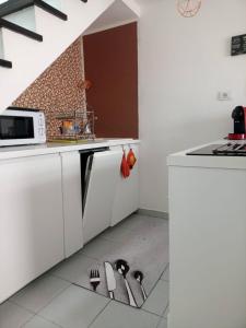Kuchyň nebo kuchyňský kout v ubytování Bungalow Lella