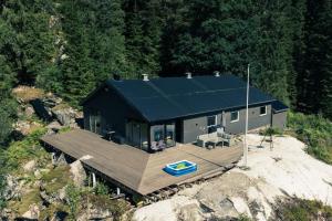an aerial view of a house on a cliff at Modalen Fjord Cottage in Mo