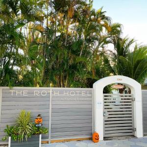 an entrance to theroth hotel with a gate and pumpkins at The Roth Hotel, Treasure Island, Florida in St. Pete Beach