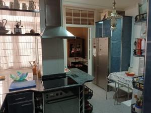Kuchyň nebo kuchyňský kout v ubytování IDEAL FAMILAS + 14 fotografií