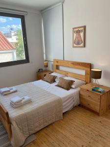 a bedroom with a large bed and a window at Demetra 1 Bdr Down Town Nicosia By Platform 357 in Nicosia