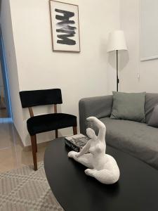 a toy rabbit sitting on a table in a living room at Demetra 1 Bdr Down Town Nicosia By Platform 357 in Nicosia