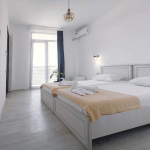 Letto o letti in una camera di Hotel General Tso Kobuleti