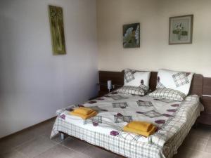 a bedroom with a bed and a couch in it at Two-Bedroom Apartment with Sea View in Kavarna