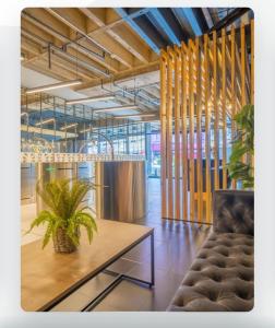 a room with a table with a plant on it at Batchelor City Studio Apartment in Durban