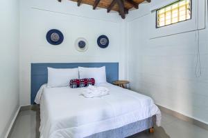 Letto o letti in una camera di Soy Local Guatape