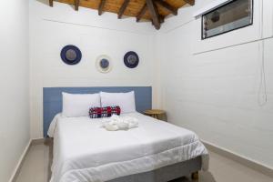 Letto o letti in una camera di Soy Local Guatape