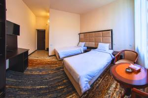 Voodi või voodid majutusasutuse Vanadzor Armenia Health Resort & Hotel toas