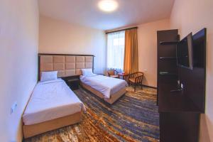 Voodi või voodid majutusasutuse Vanadzor Armenia Health Resort & Hotel toas