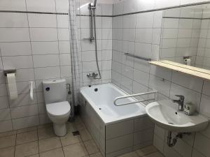 Kúpeľňa v ubytovaní Apartamenty JN Poznań Rzeczna 4