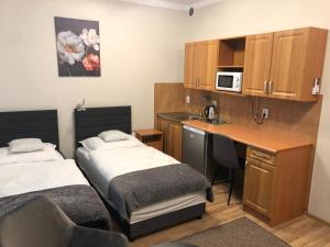 Posteľ alebo postele v izbe v ubytovaní Apartamenty JN Poznań Rzeczna 4
