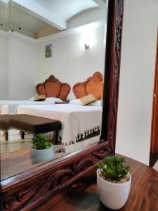 Tempat tidur dalam kamar di Hotel Patio Pombo