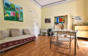 a living room with a couch and a table at 1 Bedroom Pet Friendly Apartment In Acireale in Acireale