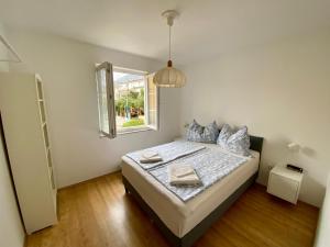 Postel nebo postele na pokoji v ubytování Apartments Hannah