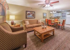 a living room with a couch and a table at Holiday Inn Club Vacations Fox River Resort at Sheridan in Sheridan