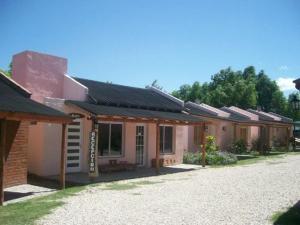 a row of buildings with solar panels on them at Cabañas Comarca del Colorado in Río Colorado