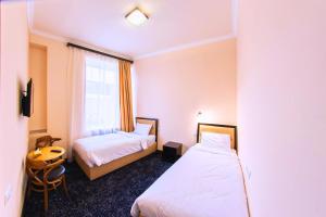 Voodi või voodid majutusasutuse Vanadzor Armenia Health Resort & Hotel toas
