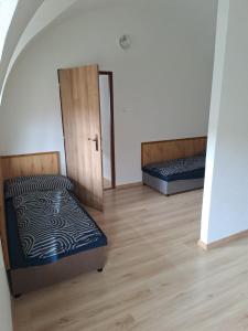 Postel nebo postele na pokoji v ubytování Ubytovanie v centre Hliníka nad Hronom