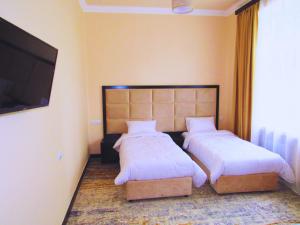 Voodi või voodid majutusasutuse Vanadzor Armenia Health Resort & Hotel toas