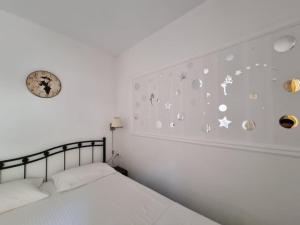 a bedroom with a bed with planets and stars on the wall at Corfu Dream Holidays Villas 2-4 in Glyfada