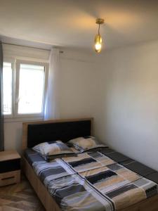 Łóżko lub łóżka w pokoju w obiekcie St Vélodrome 3 chambres parking 8 couchages neuf