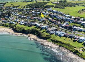 an aerial view of a resort next to the ocean at Banksia by the Sea Gerroa in Gerroa