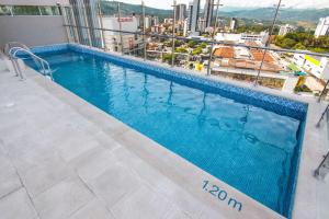 a swimming pool on the roof of a building at Sonesta Hotel Bucaramanga in Bucaramanga +33 photos
