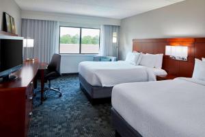 Sonesta Select Raleigh Durham Airport Morrisville客房内的一张或多张床位