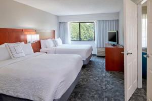 Sonesta Select Raleigh Durham Airport Morrisville客房内的一张或多张床位